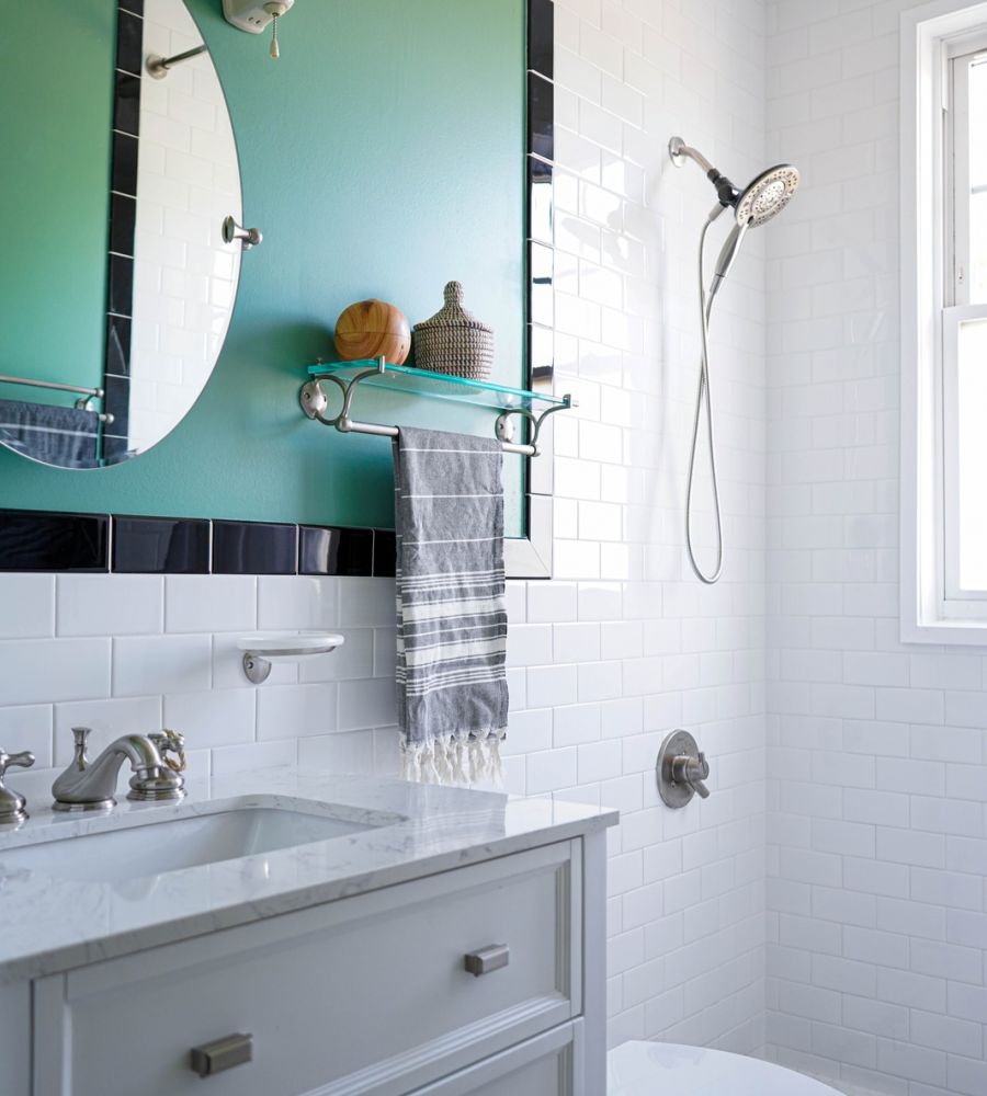 Bathroom With Green Wall White Tiles And Modern Fixtures