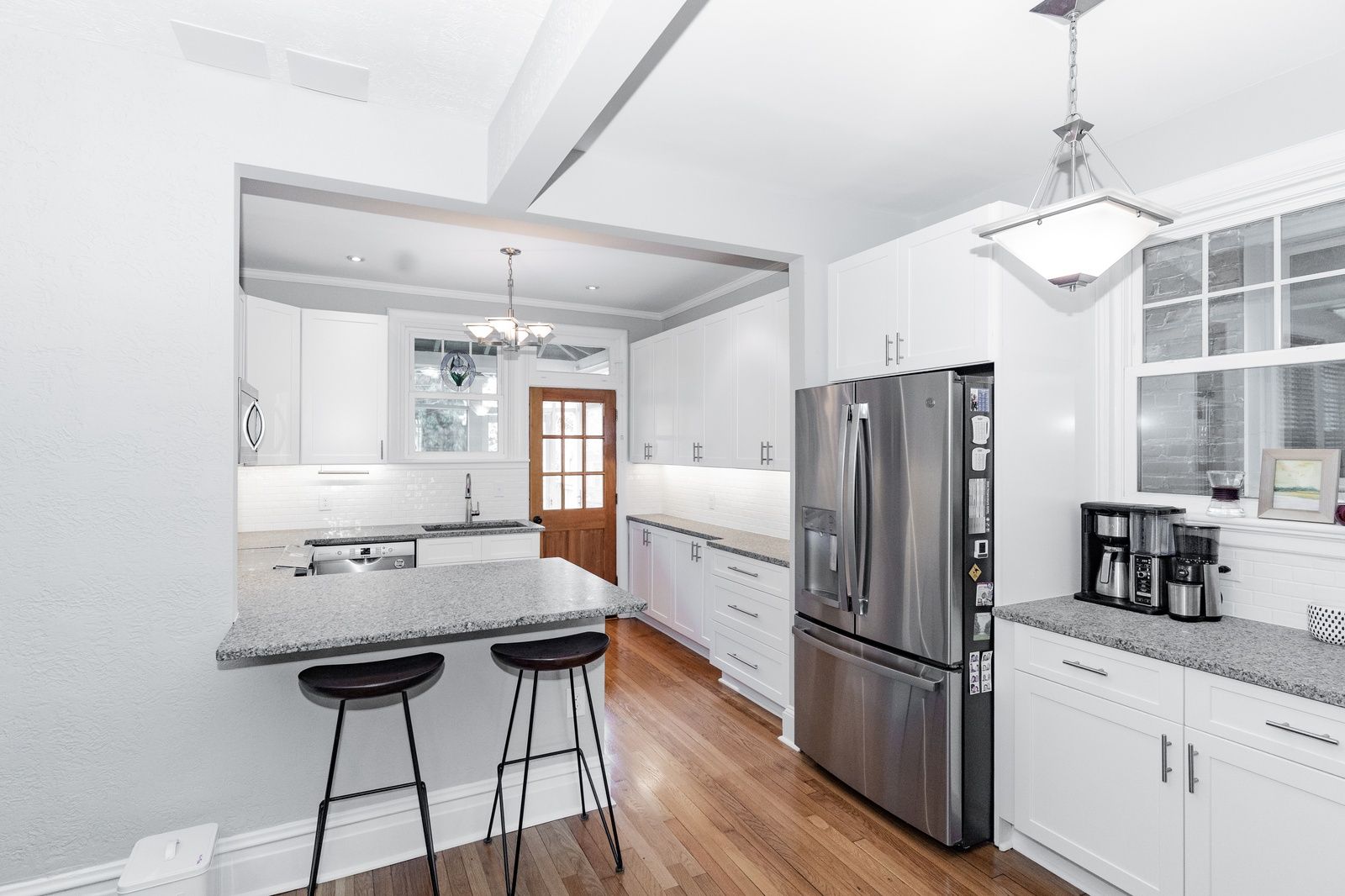 Modern Kitchen With Gray Counters And White Cabinets
